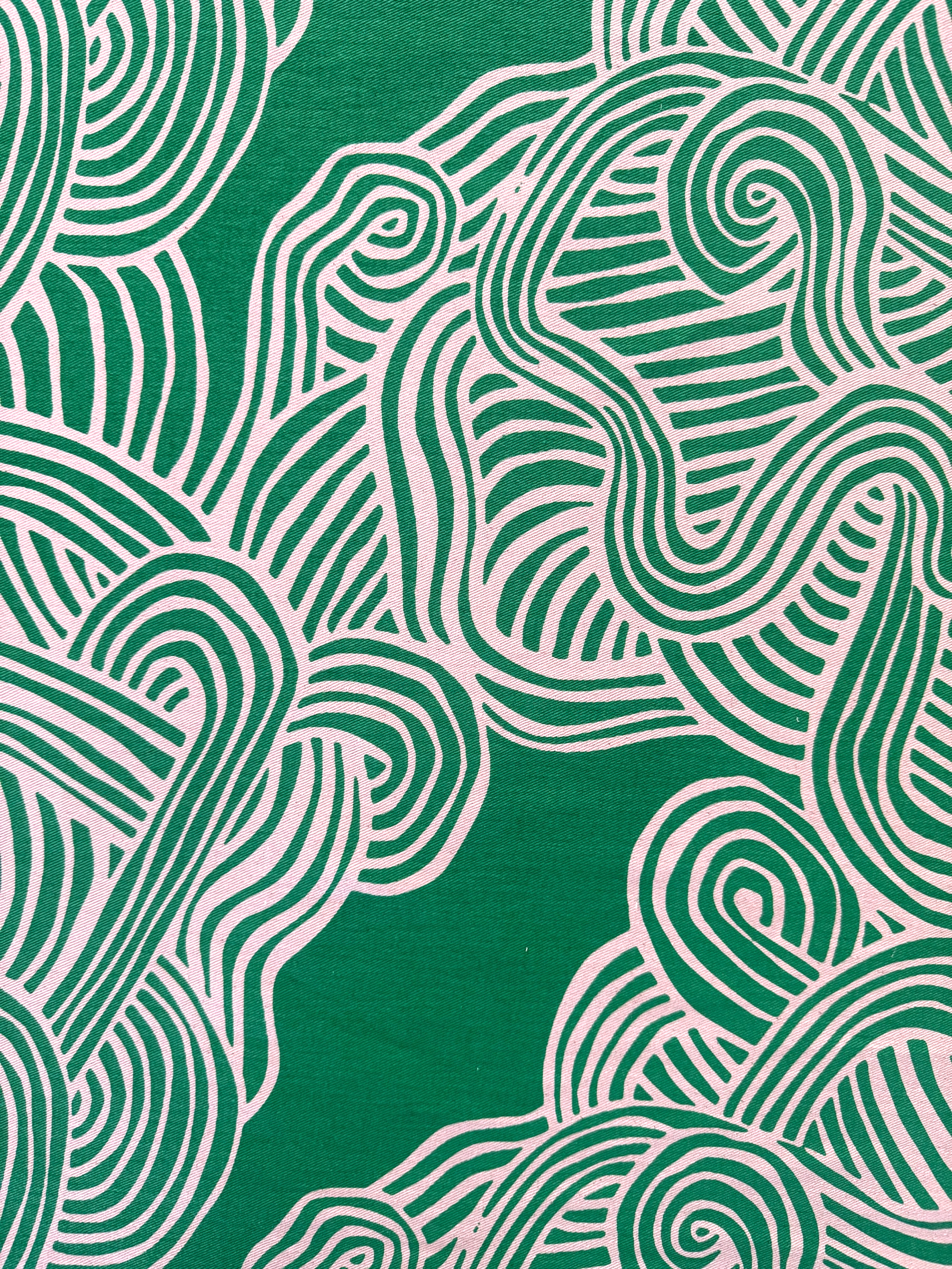 Green and white wavy line pattern on a green background