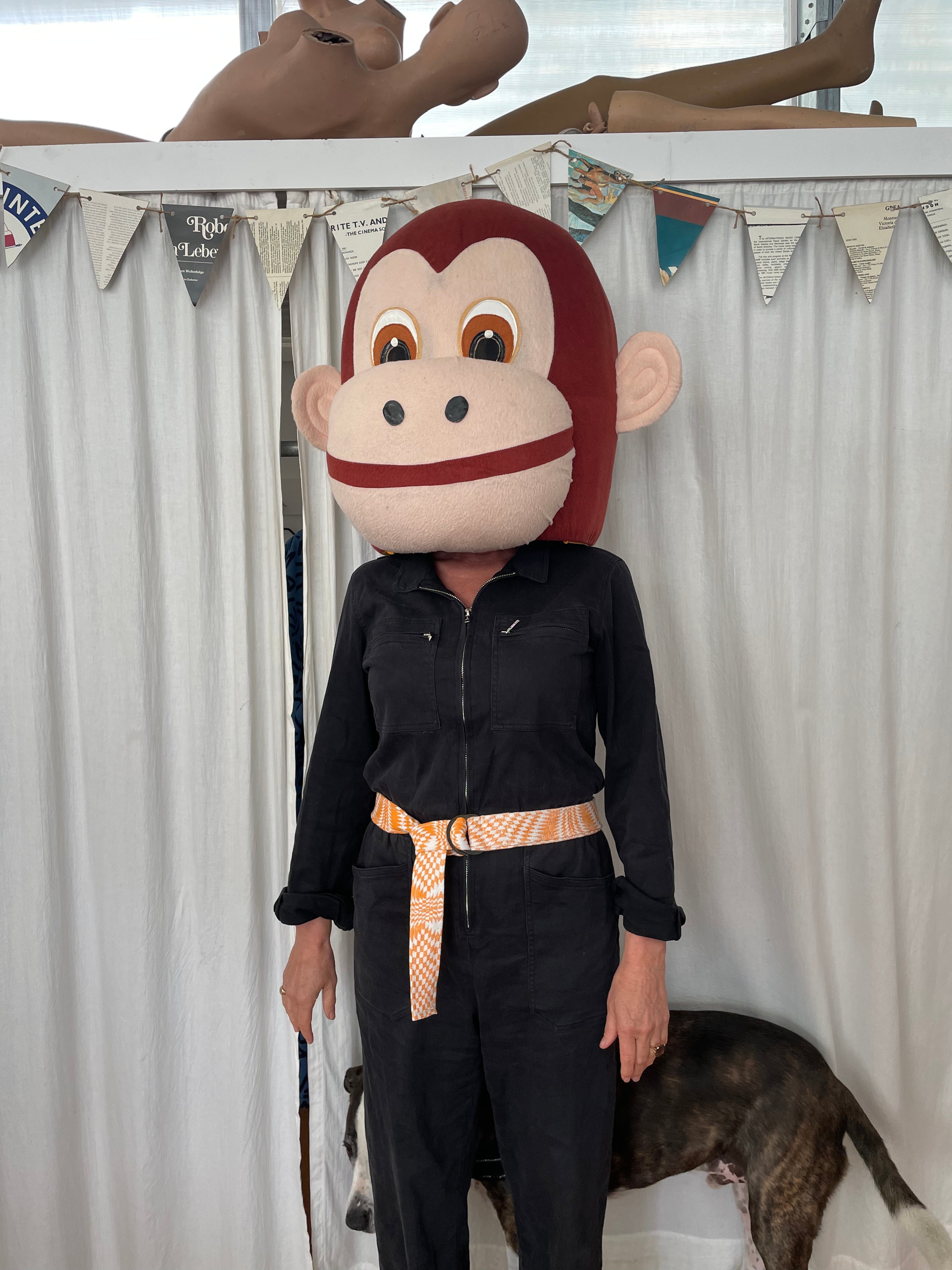 Person with monkey head wearing Hand Printed Loop Belt with dog in background