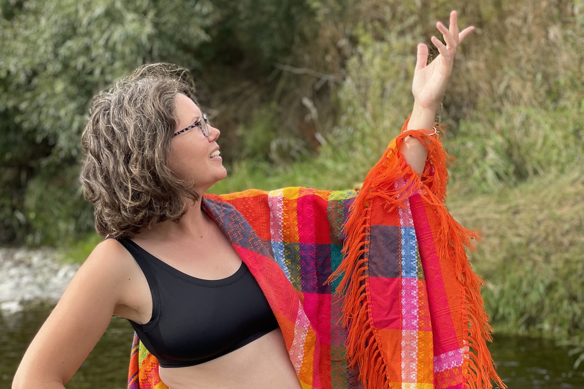 Person in swim crop with colourful wrap