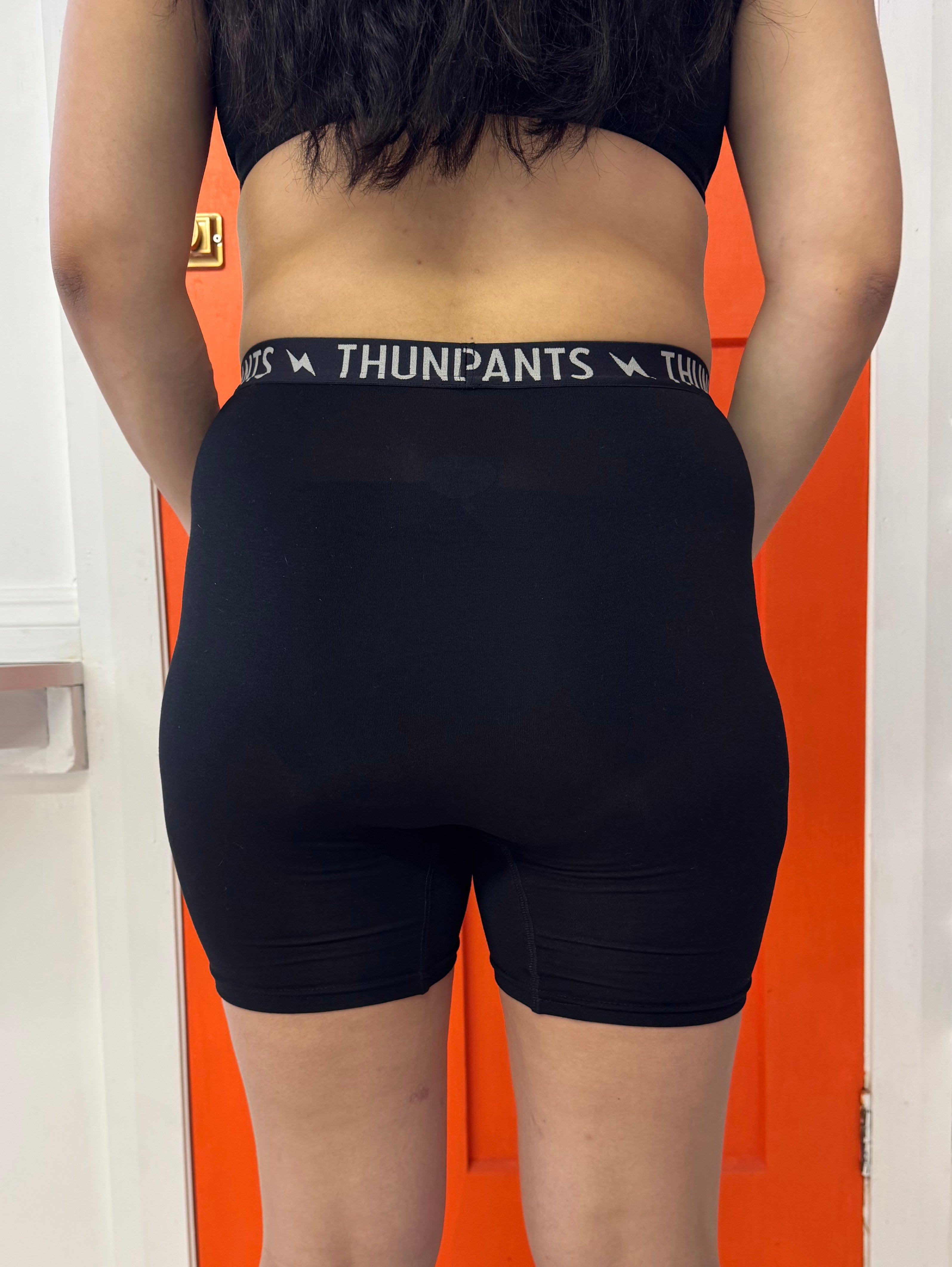 Backview of pregnant person in Everybody boxer