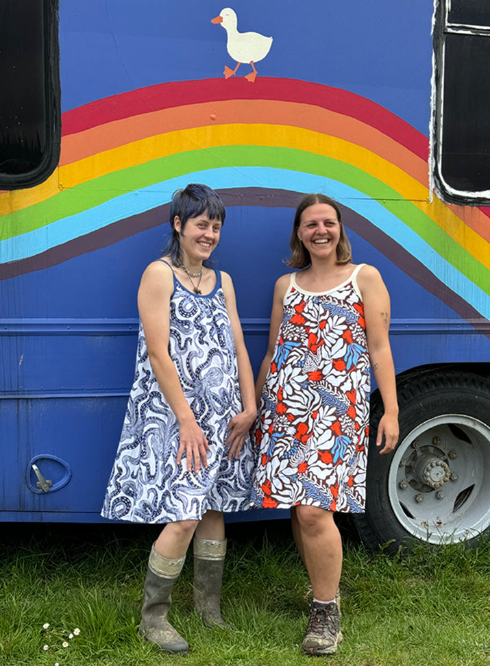 Cami Dreses on models in front of a bus