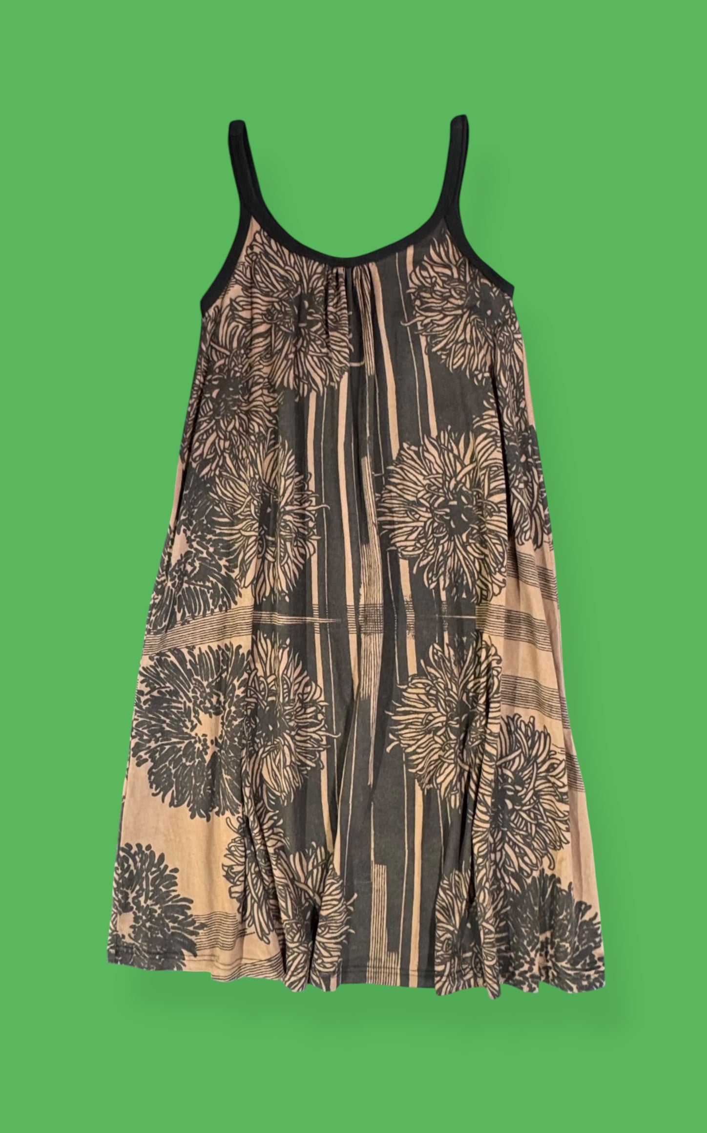 Floral patterned dress on a green background