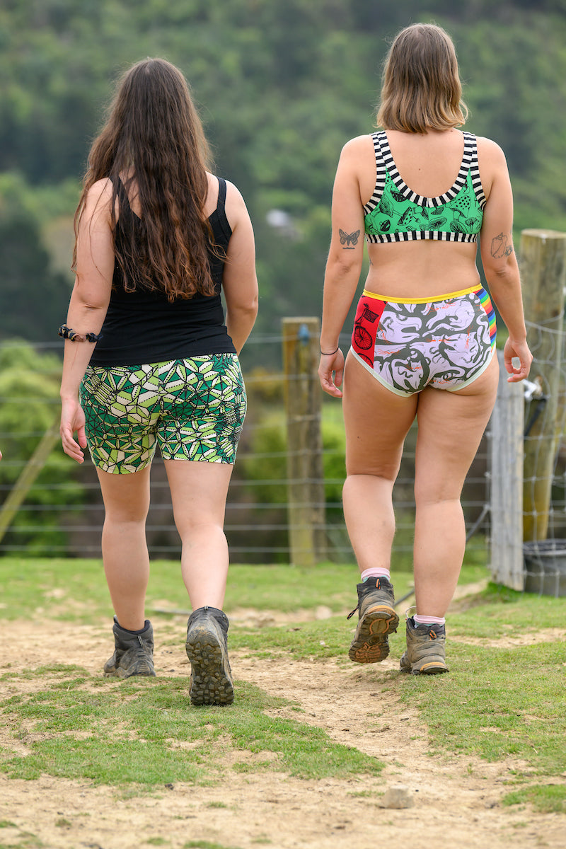 Models wearing camis and crops walking away