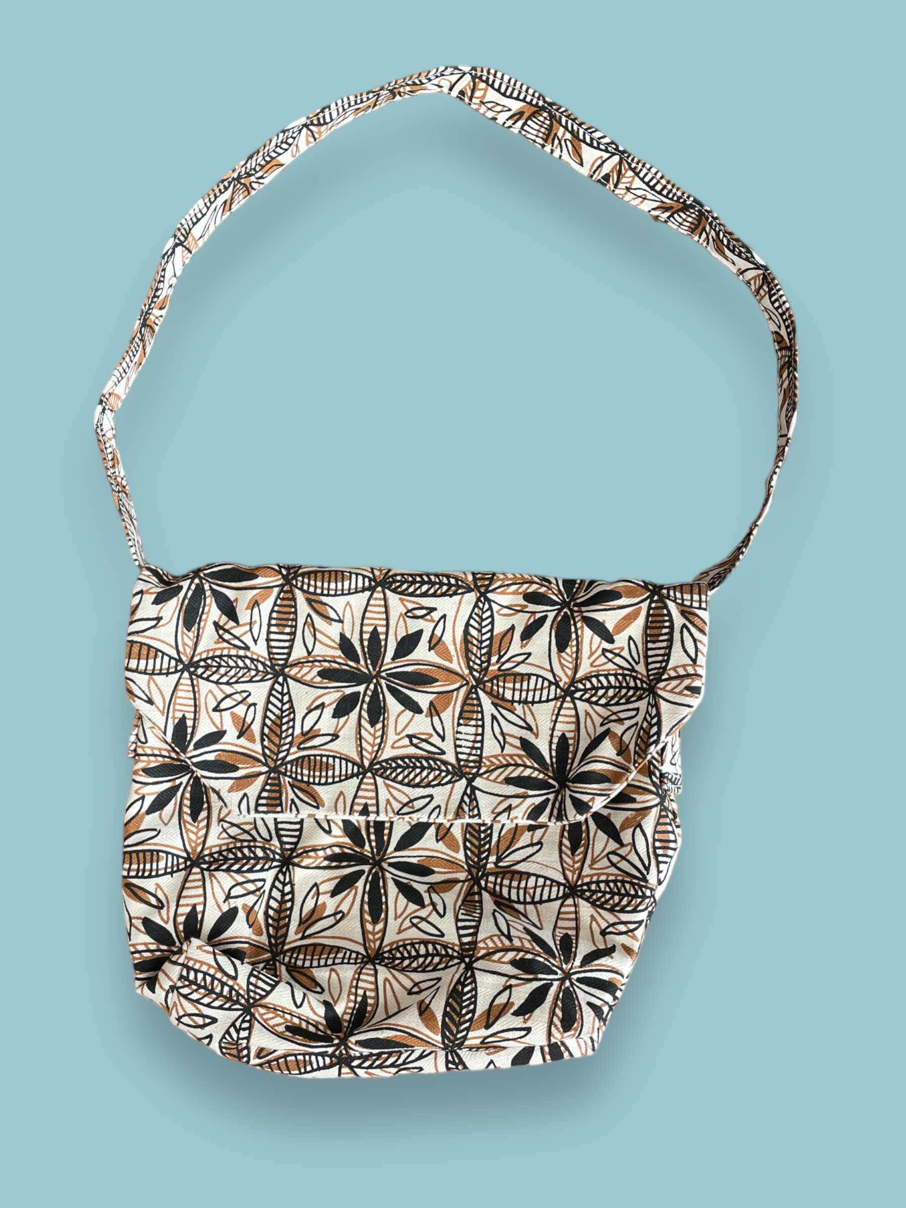 satchel with handprinted stylised frangipani flower design