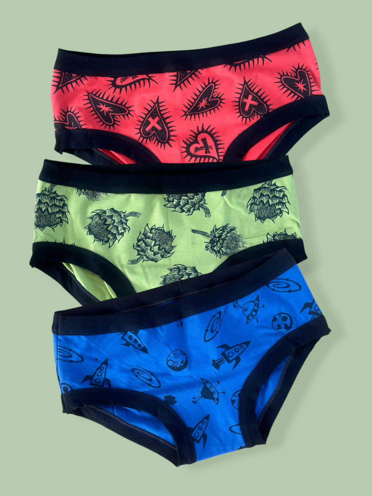 three pairs of hipsters on a green background