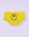 Yellow underwear with a smiley face design on a light purple background