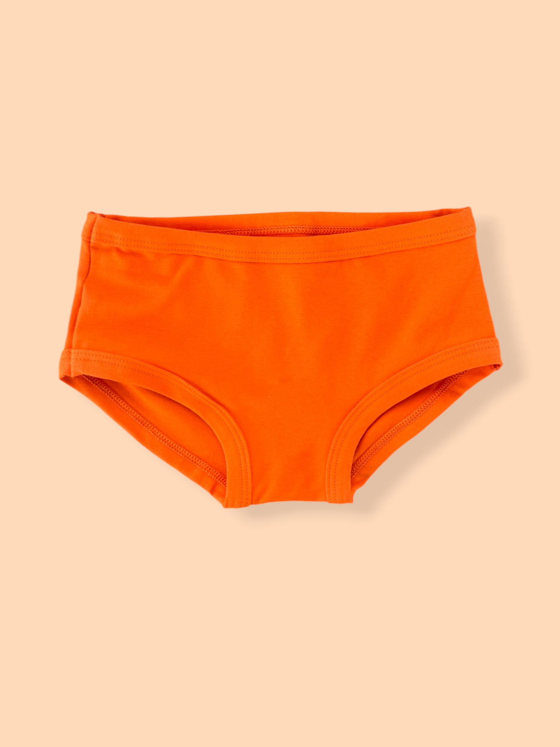 Kids Original tangerine underpants on orange background