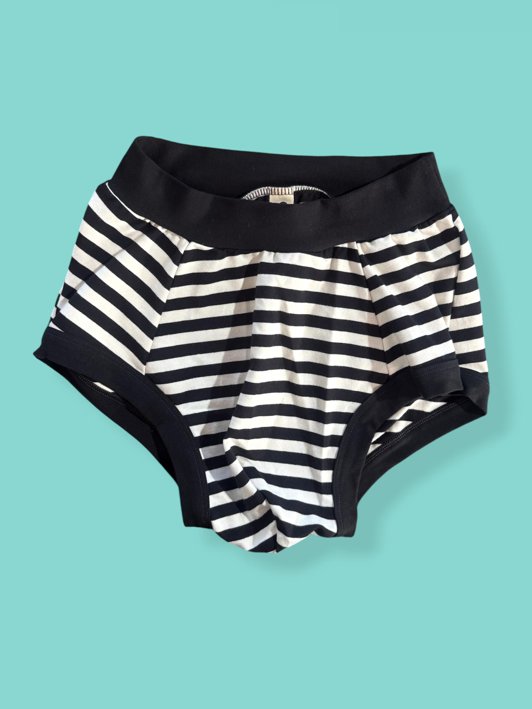 Pouch Fronted Brief liquorice on blue background