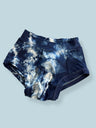 Pouch Brief  dyed in an Indigo vat after being scrunched on a pale blue background