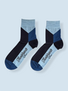 Pair of black and blue socks with 'Thunderbolts' branding on a light gray background