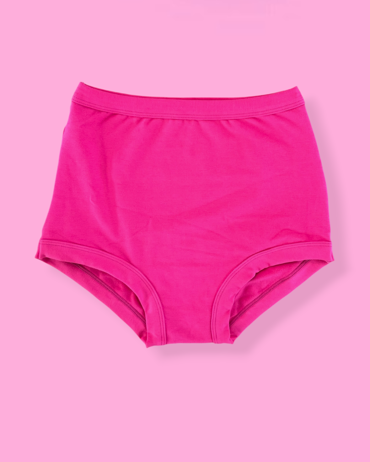 Pink high-waisted underwear on a pink background