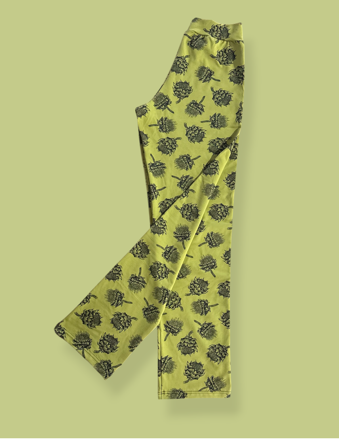 Green patterned fabric on a matching green background